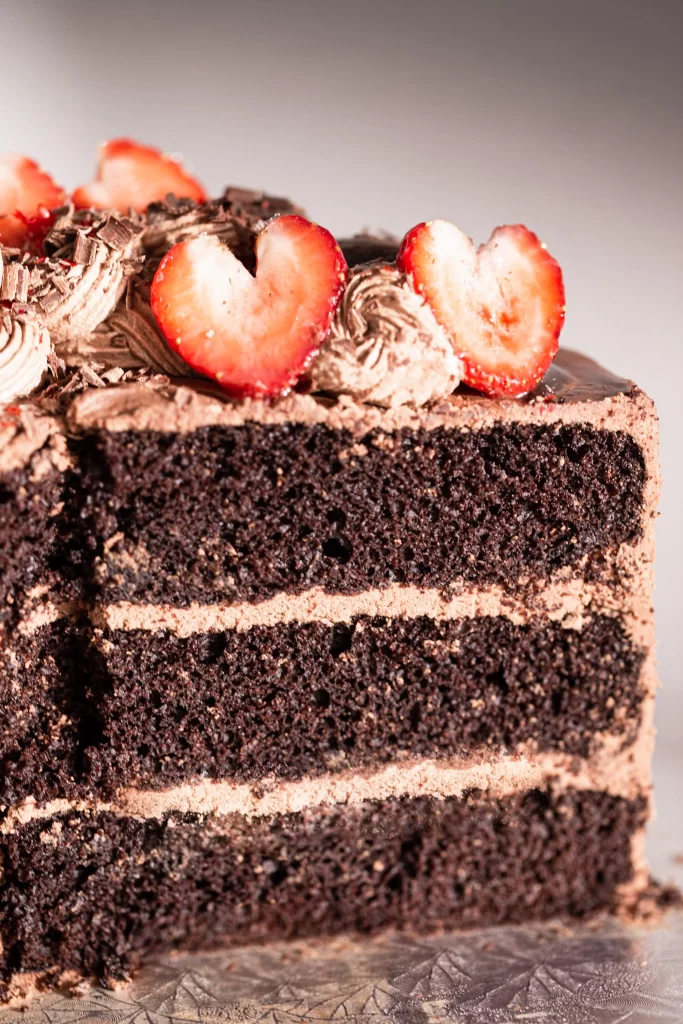 Decadent Chocolate Cake with Chocolate Ganache and Fresh Strawberry Hearts Slice